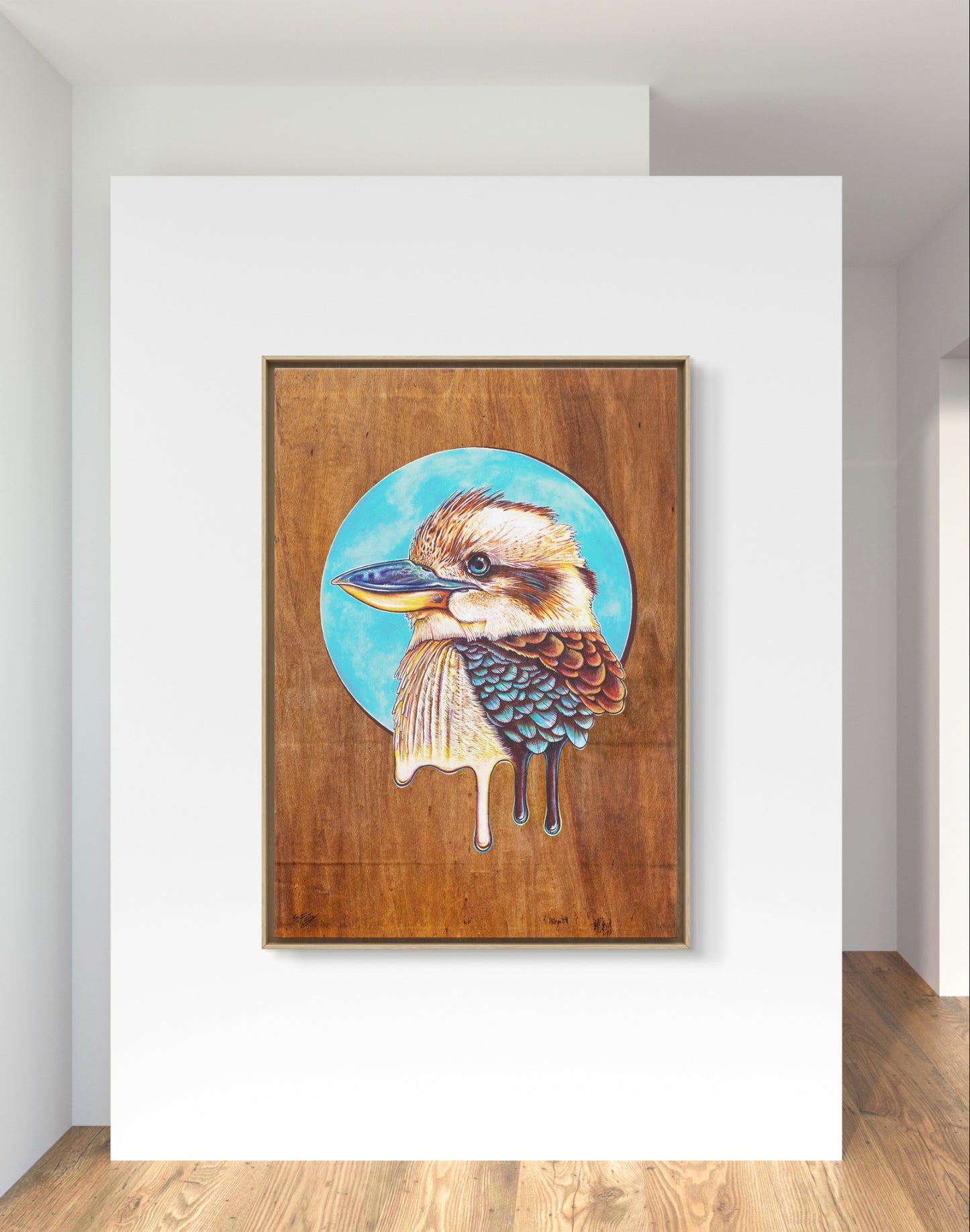 Colorful acrylic illustration on plywood of a native Australian Kookaburra bird by Skotty Fairclough hung in a home decor setting.